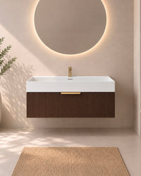 noyer-80cm-vue-face
Meuble de salle de bain suspendu Soha 80 cm en noyer avec grande vasque blanche en solid surface, vue de face.
